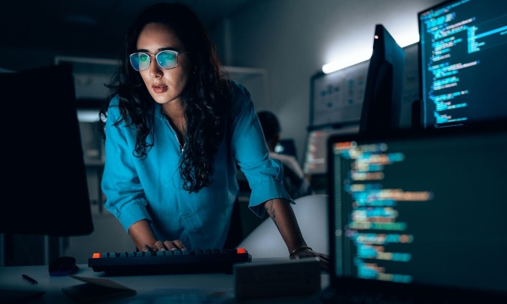 Cybersecurity engineer reviewing code