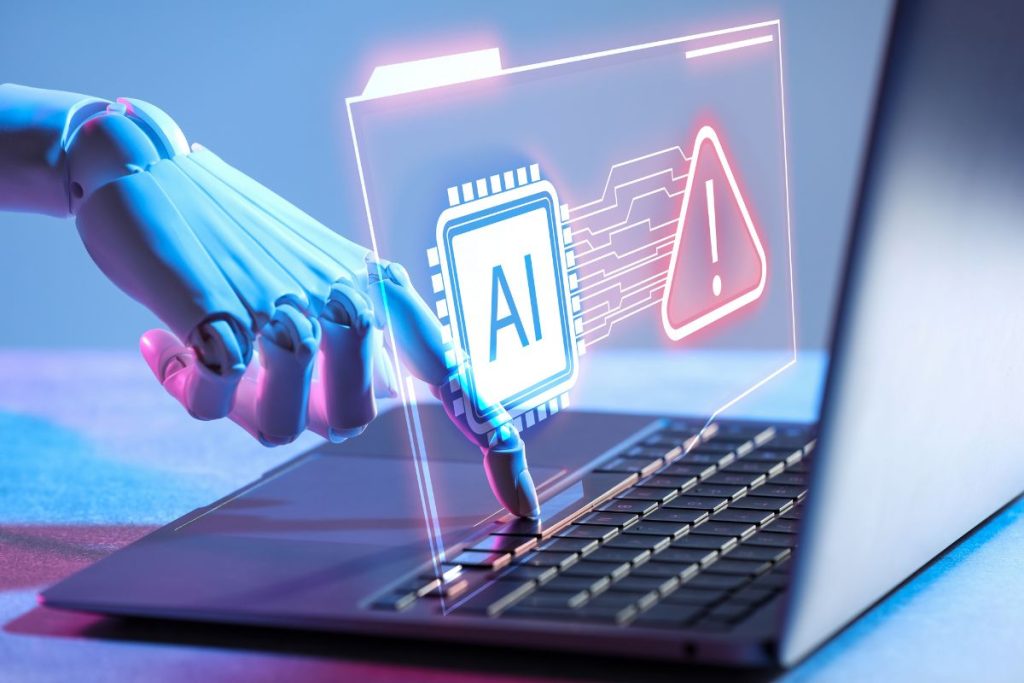 AI-powered cyber threat warning displayed on laptop with robotic hand interacting with digital security interface