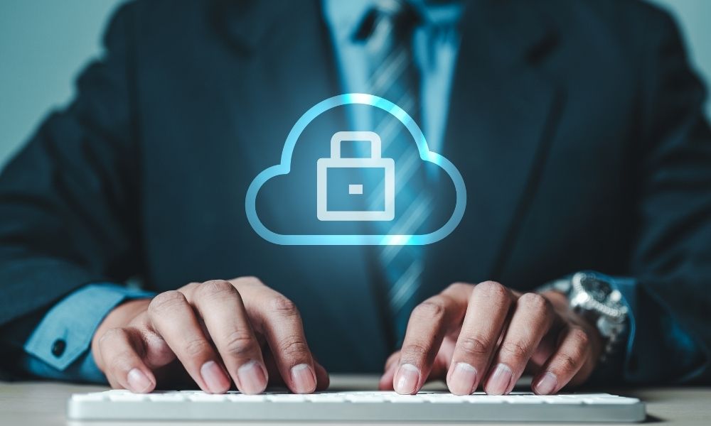 Cloud security protection icon above business keyboard typing